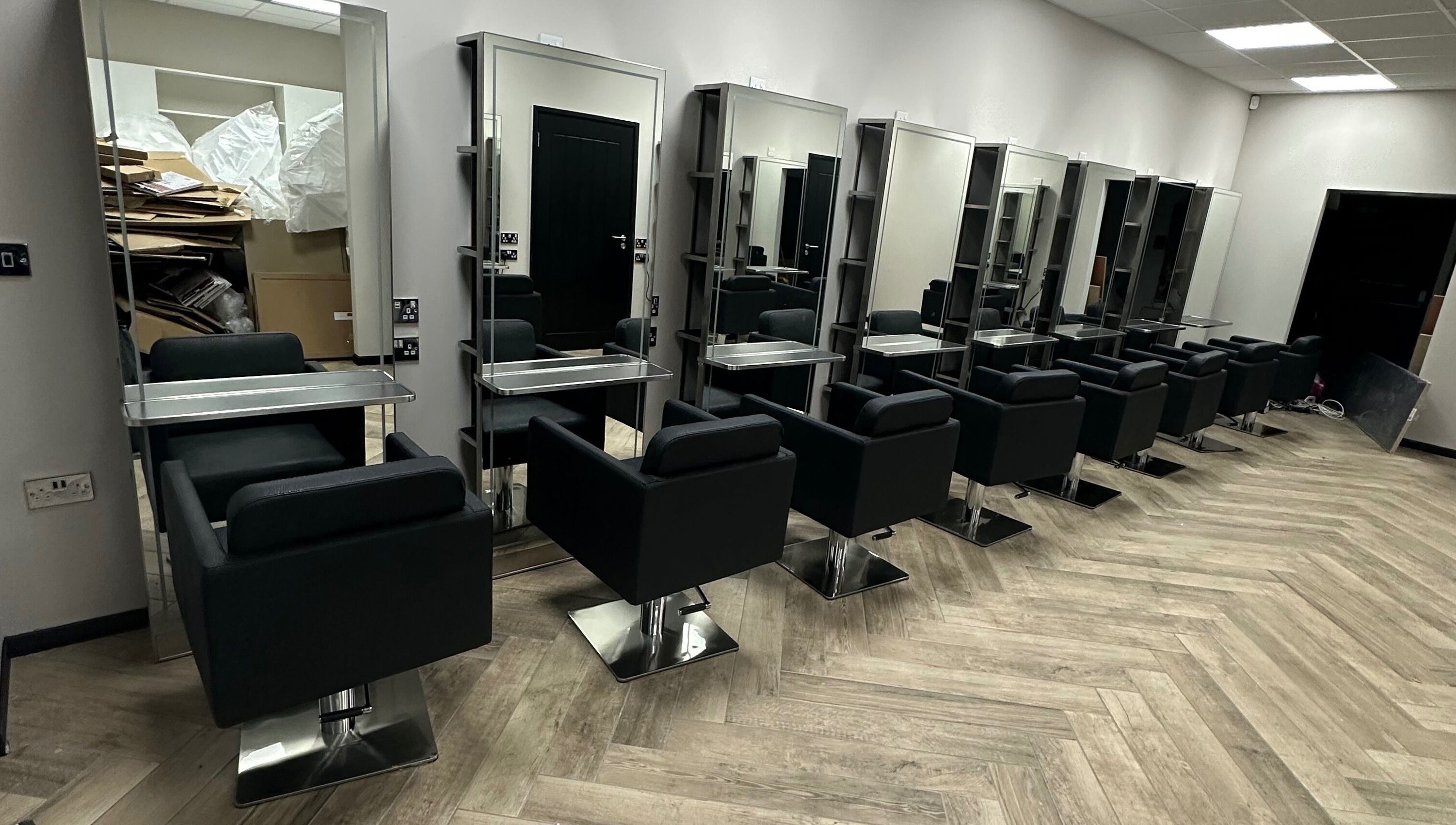 Modern salon chairs and mirrors at Gorgeous Melksham in Melksham, England, GB, showcasing sleek design.