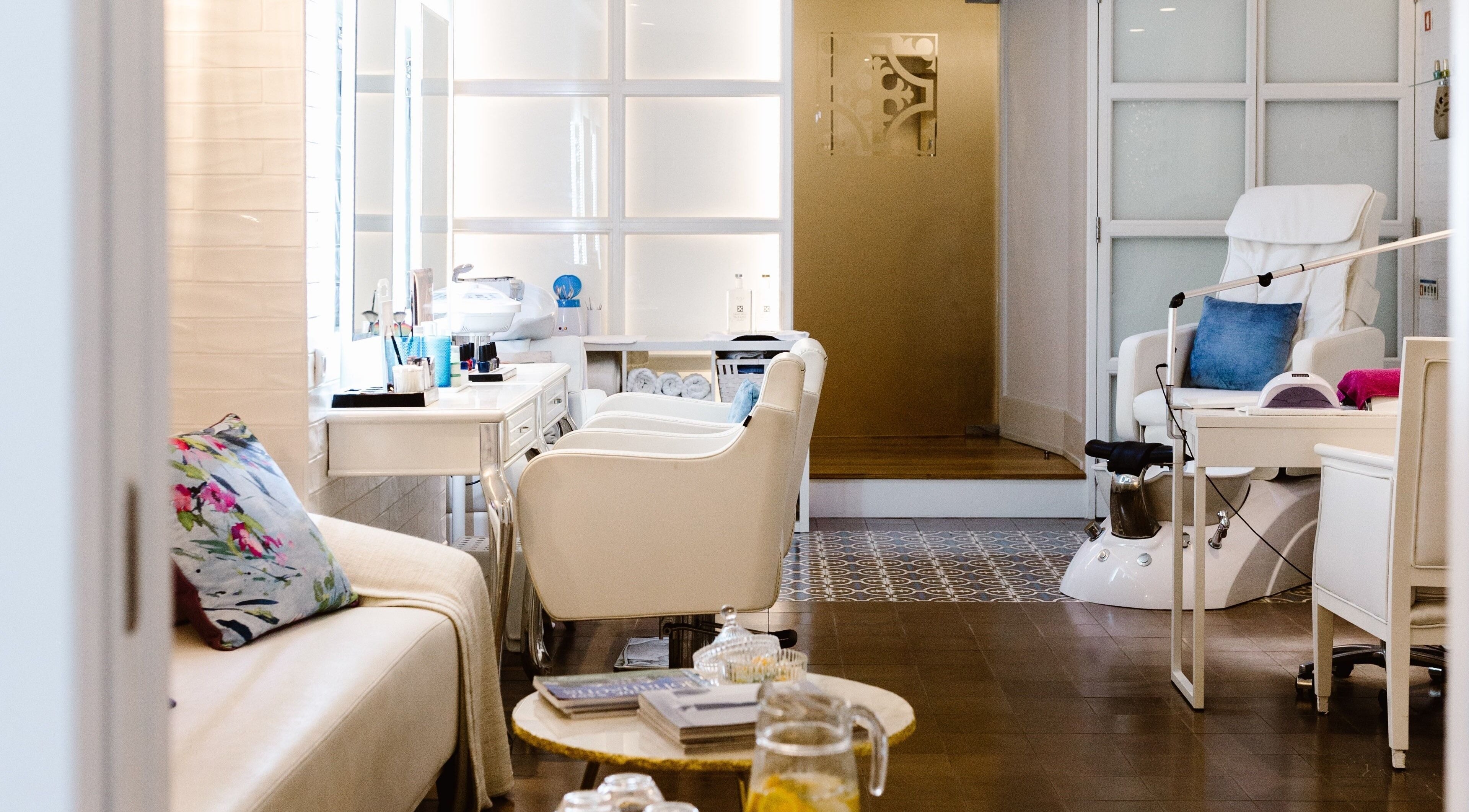 Chic salon interior at The Beauty Bar, Lisboa, Lisboa, PT, featuring plush seating and modern decor.