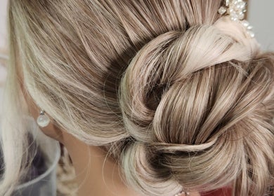 Chic updo style at Jes Harrington Hair, Ennismore, Ontario, CA. Intricately styled blonde hair.