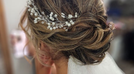 Bridal updo with pearl accessory at Jes Harrington Hair, Ennismore, Ontario, CA.