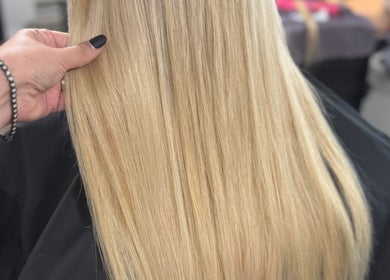Smooth blond hair styled at Jes Harrington Hair, Ennismore, Ontario, CA, showcasing expert salon care.