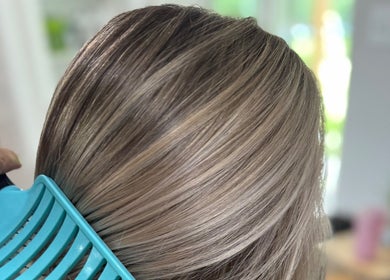 Sleek hair combing at Jes Harrington Hair, Ennismore, Ontario, CA.
