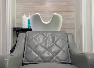 Modern salon chair and sink at Jes Harrington Hair, Ennismore, Ontario, CA, showcasing sleek elegance.