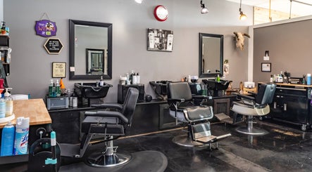 Modern interior of Grit Salon & Barbering in Pasco, Washington, US featuring sleek barber chairs and clean aesthetics.