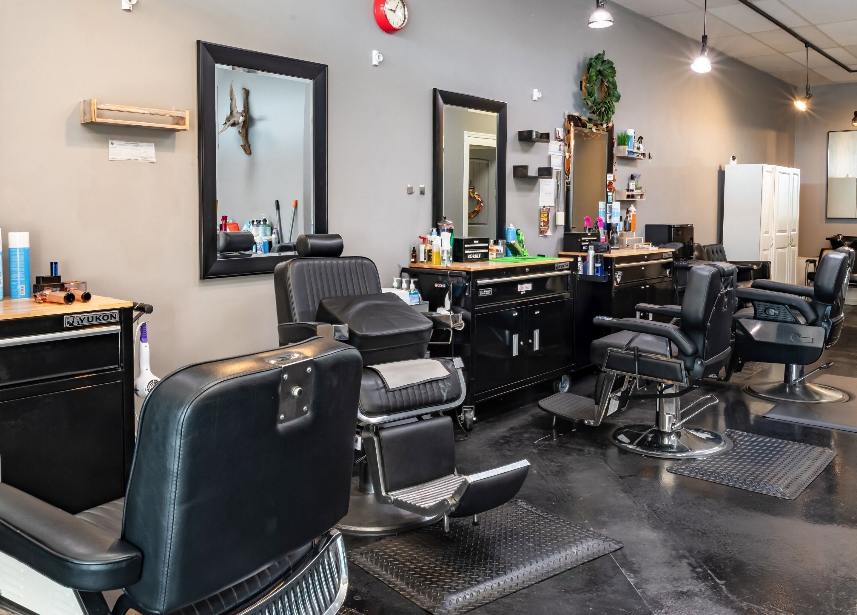 Interior of Grit Salon & Barbering in Pasco, Washington, US showcasing modern barber chairs and mirrors.