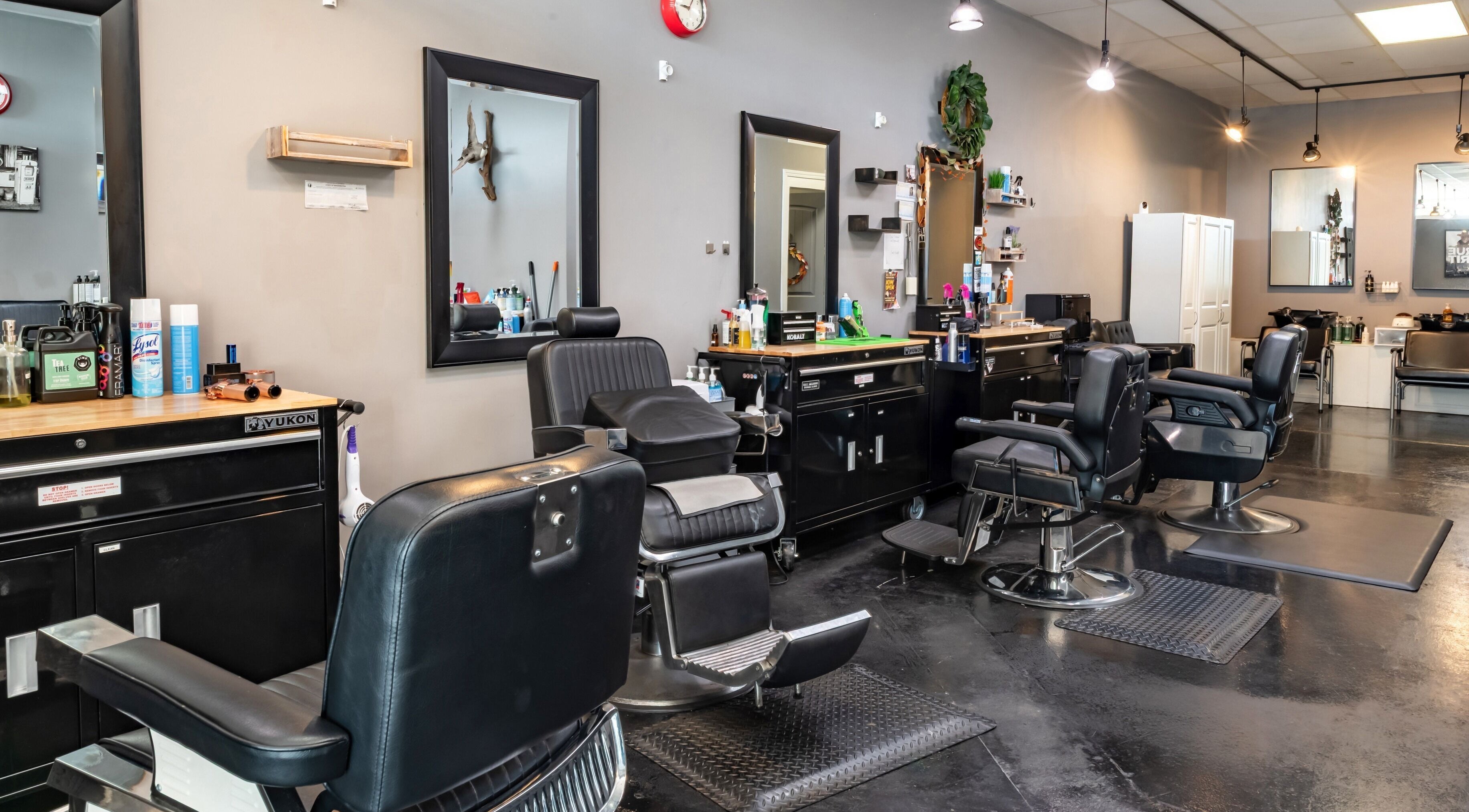 Interior of Grit Salon & Barbering in Pasco, Washington, US showcasing modern barber chairs and mirrors.