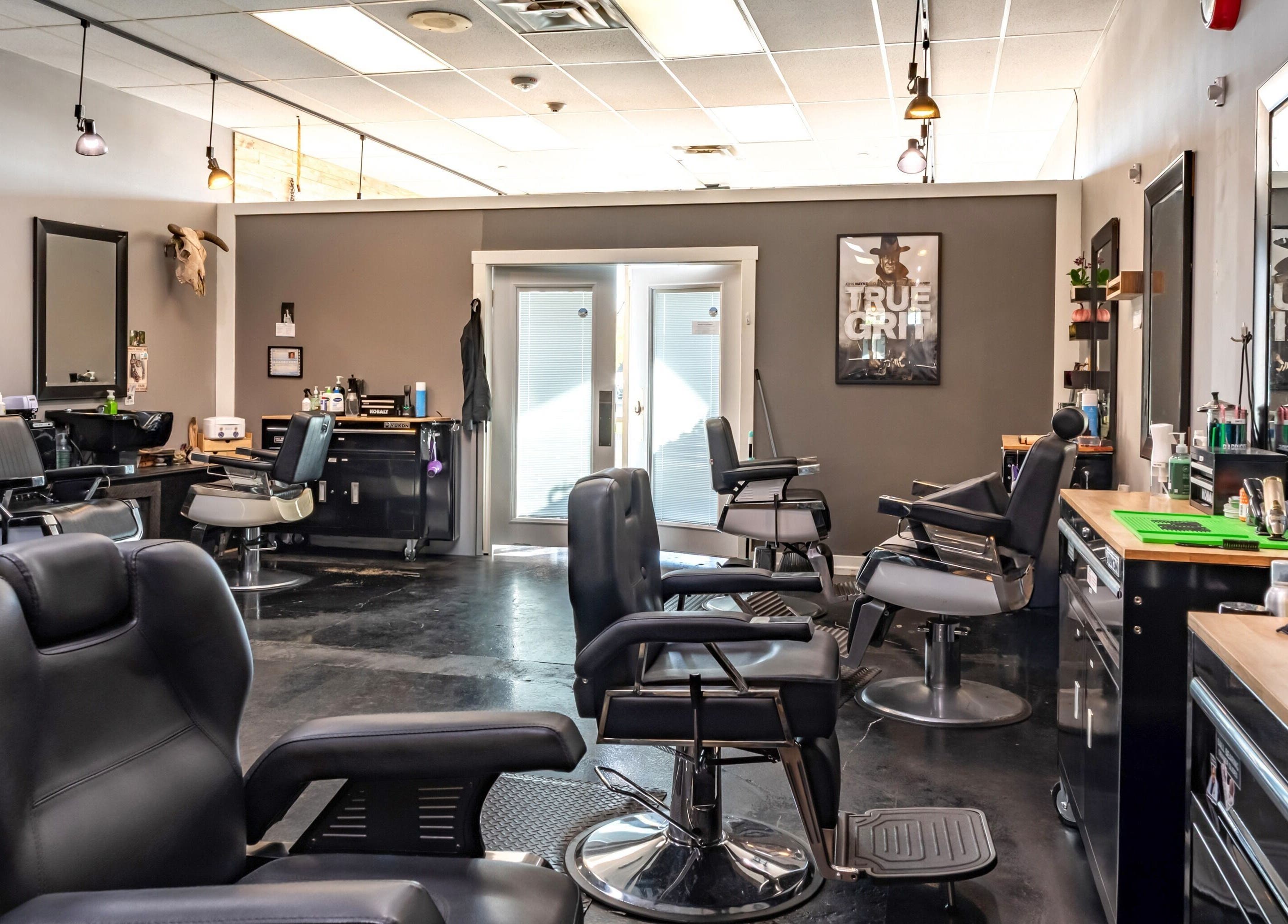 Interior of Grit Salon & Barbering, Pasco, Washington, US, featuring modern barber chairs and sleek decor.