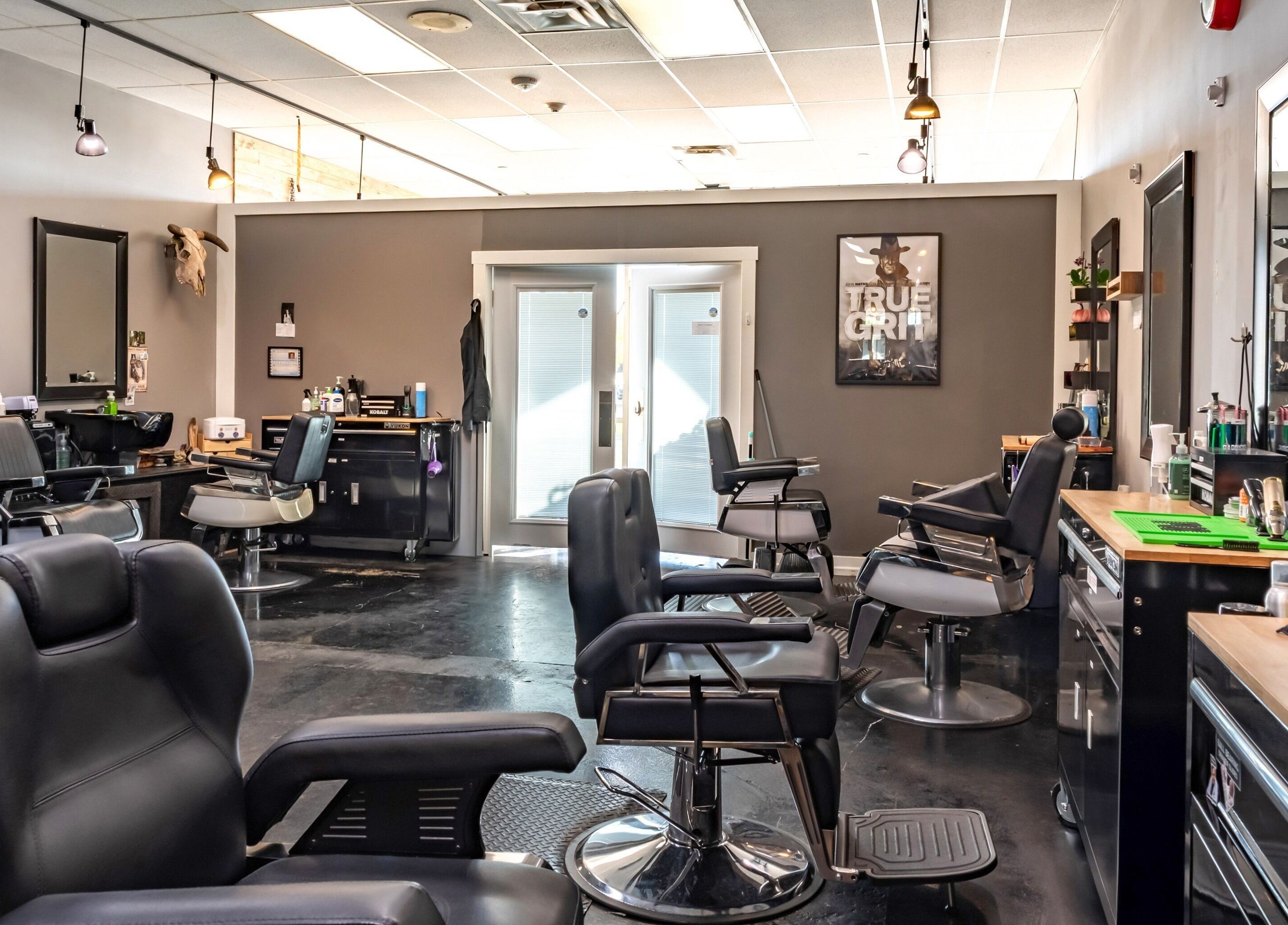 Interior of Grit Salon & Barbering, Pasco, Washington, US, featuring modern barber chairs and sleek decor.