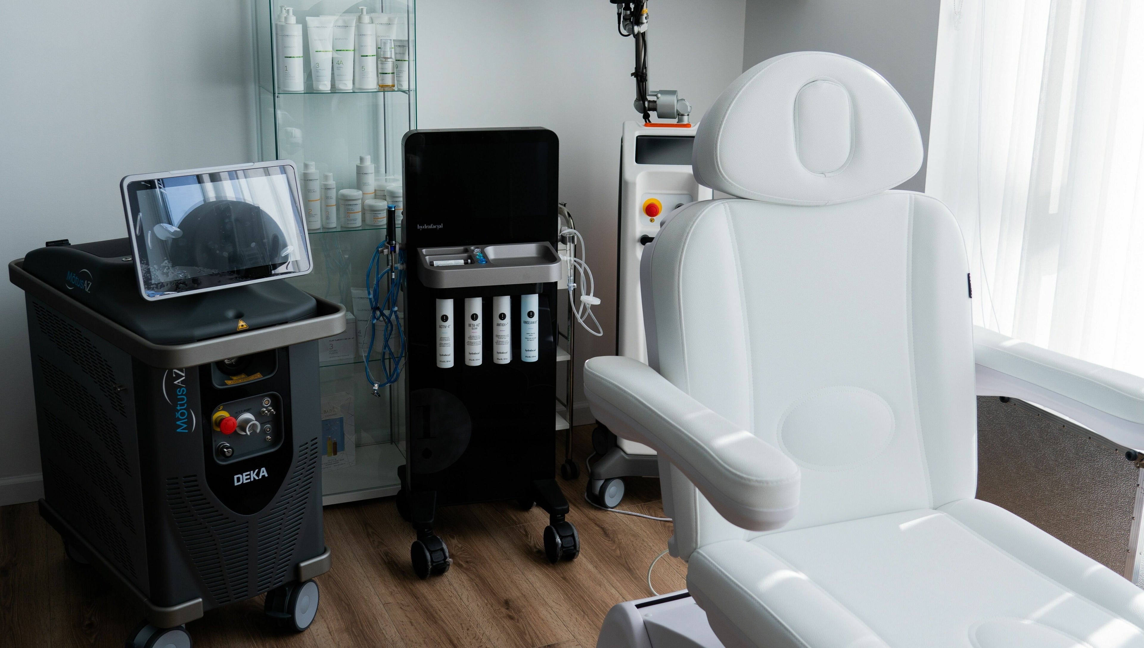 AJ Laser and Spa treatment room in New York featuring advanced equipment and luxury chair.