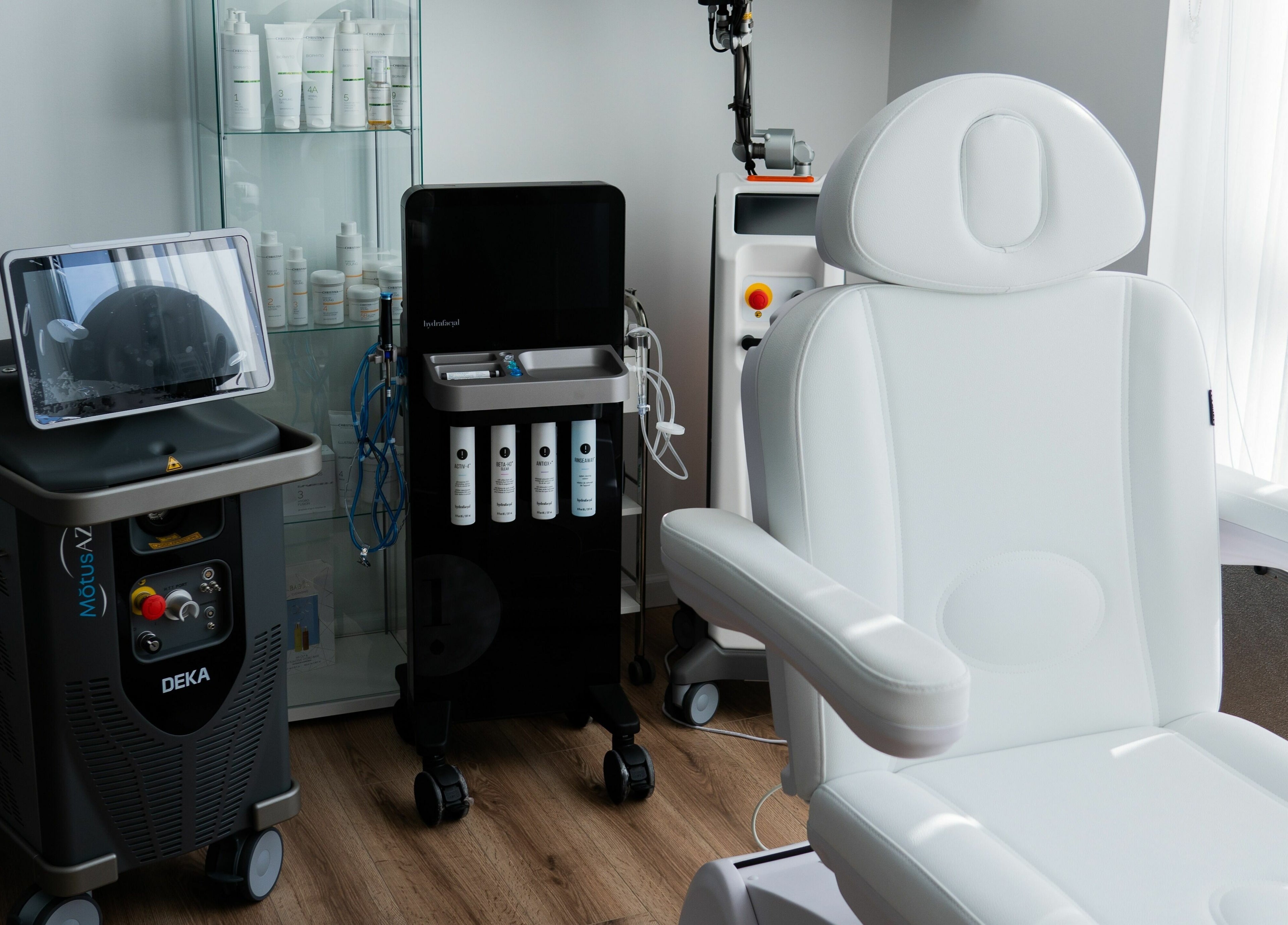 AJ Laser and Spa treatment room in New York featuring advanced equipment and luxury chair.