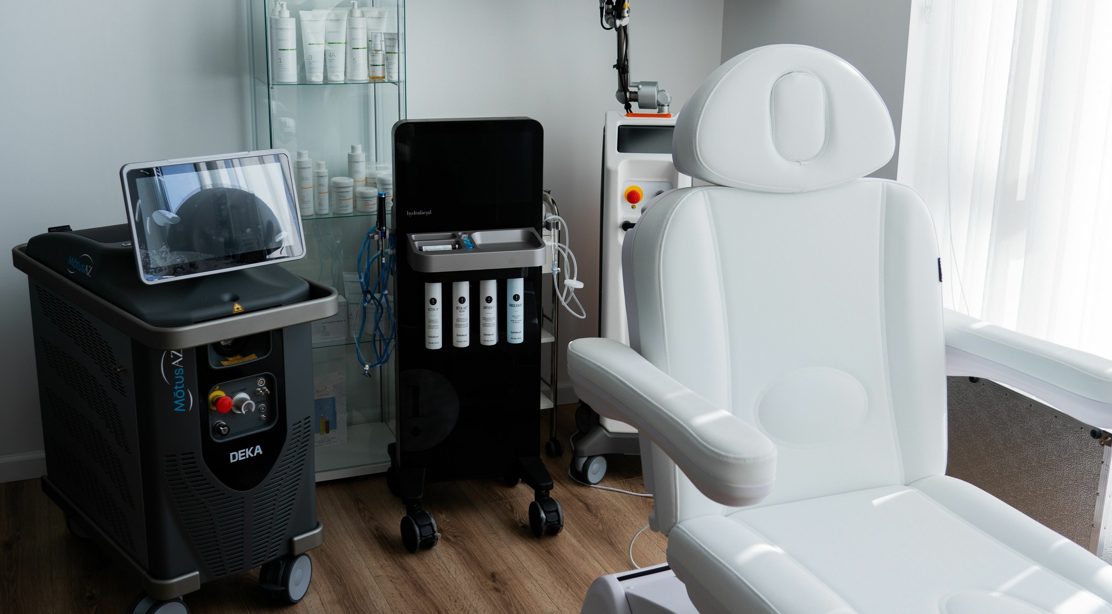 AJ Laser and Spa treatment room in New York featuring advanced equipment and luxury chair.