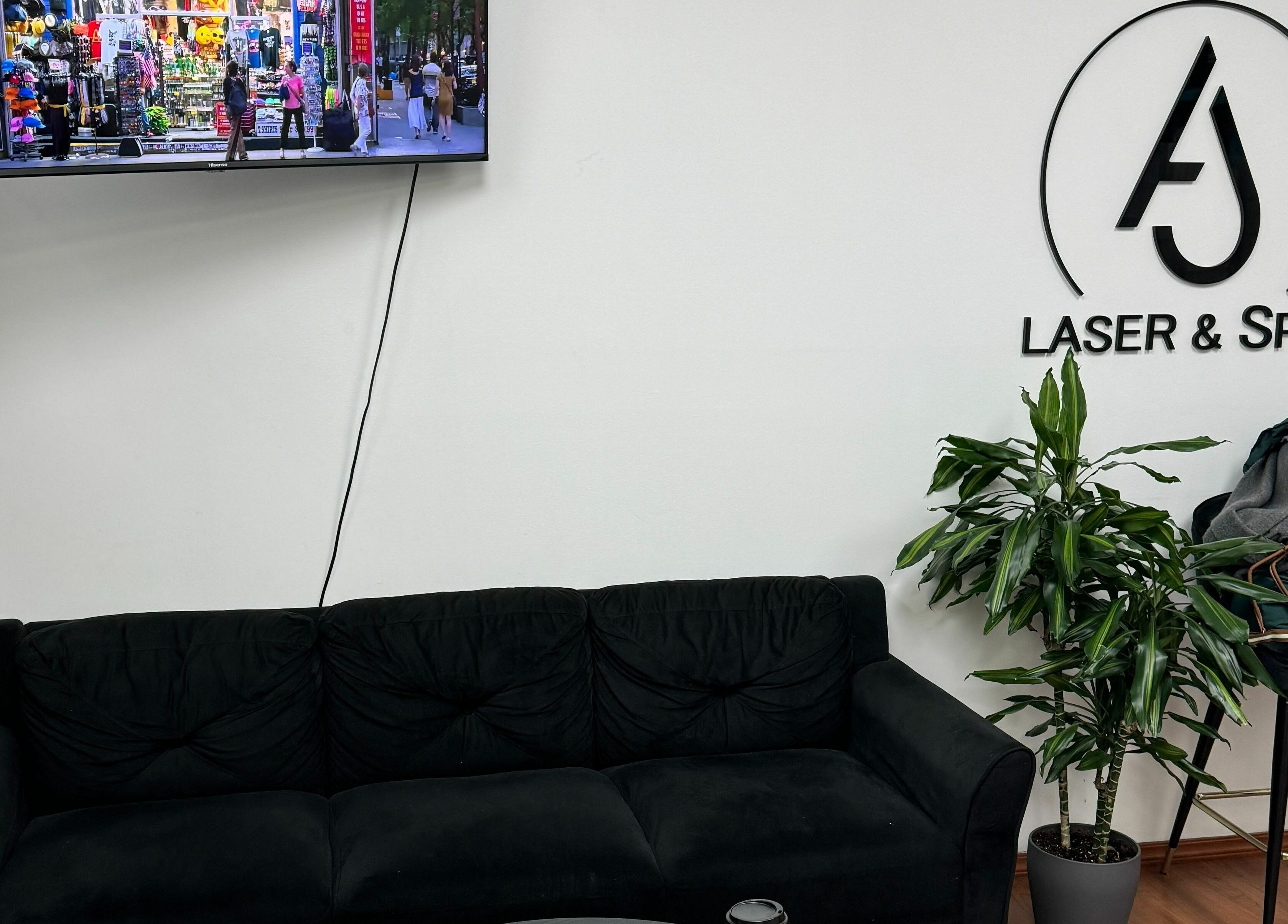 Cozy lounge area at AJ Laser and Spa in New York, New York, US with sleek furniture and decor.