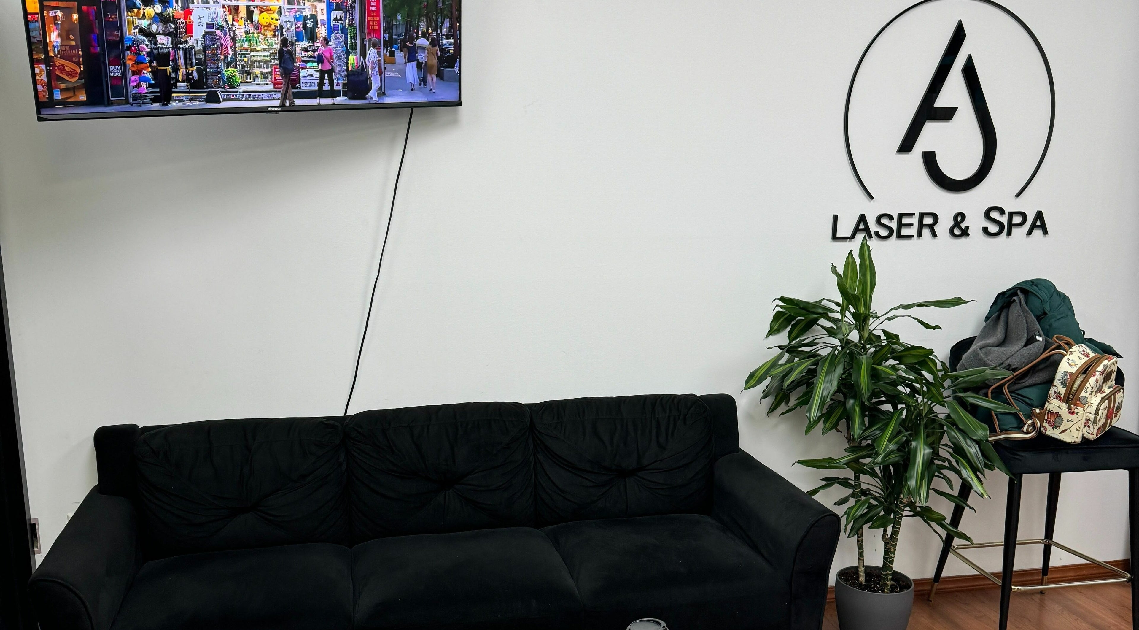 Cozy lounge area at AJ Laser and Spa in New York, New York, US with sleek furniture and decor.