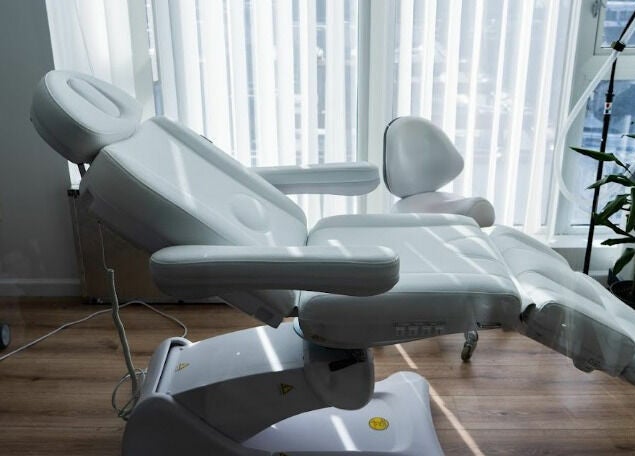 Luxurious treatment chair at AJ Laser and Spa, New York, New York, US, bathed in natural light.