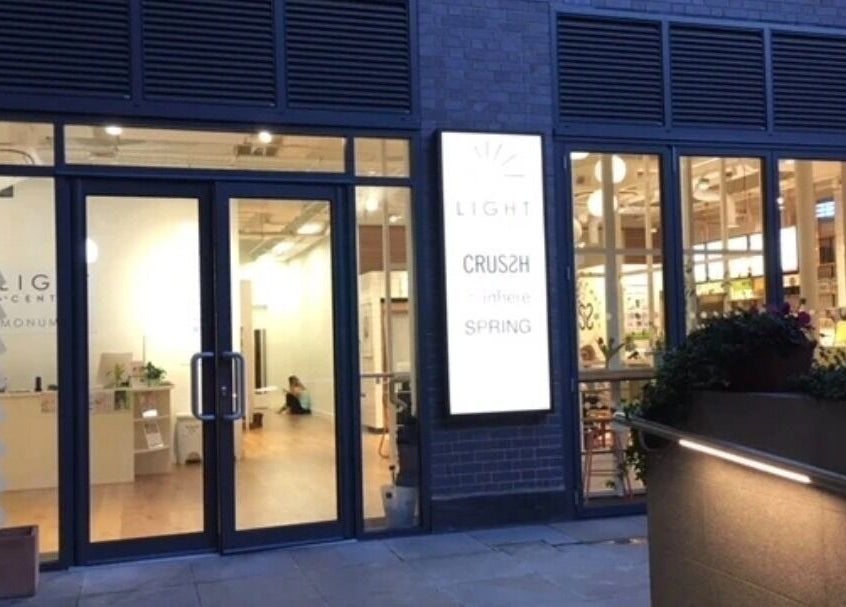 Celestial Treatments - City, inviting entrance in London, England, GB, features glass doors and warm lighting.