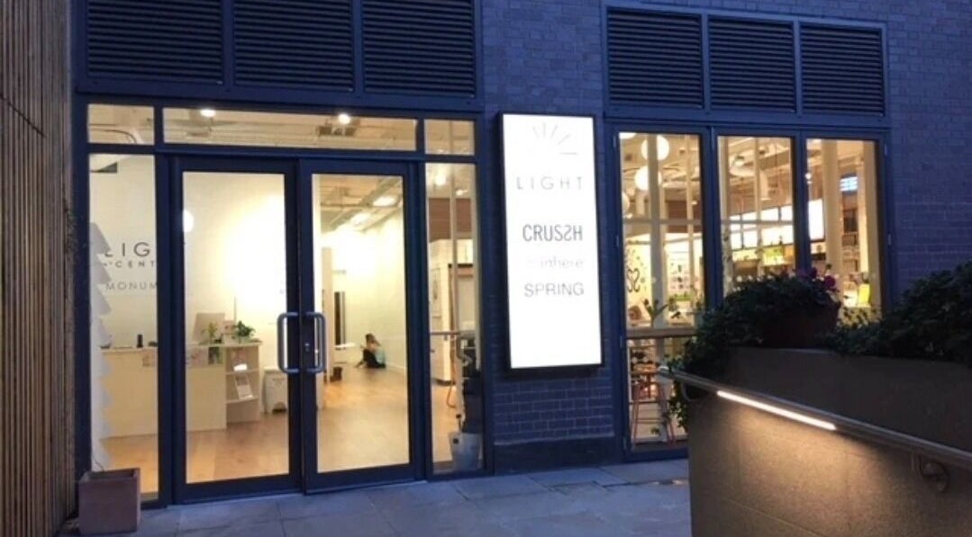 Celestial Treatments - City, inviting entrance in London, England, GB, features glass doors and warm lighting.