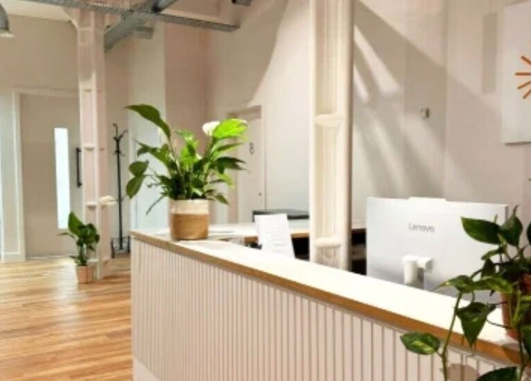 Lobby view of Celestial Treatments - City, London, England, GB with plants and wooden flooring.