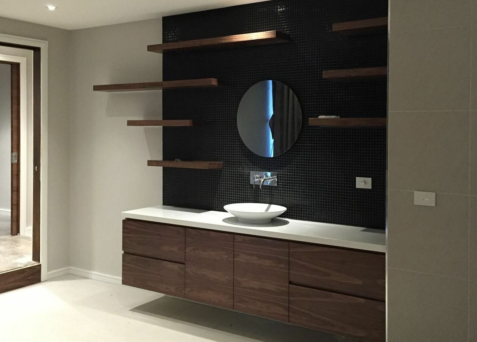 Modern vanity area at Laurel Beauty And Spa | Docklands with stylish shelving, Docklands, Victoria, AU.