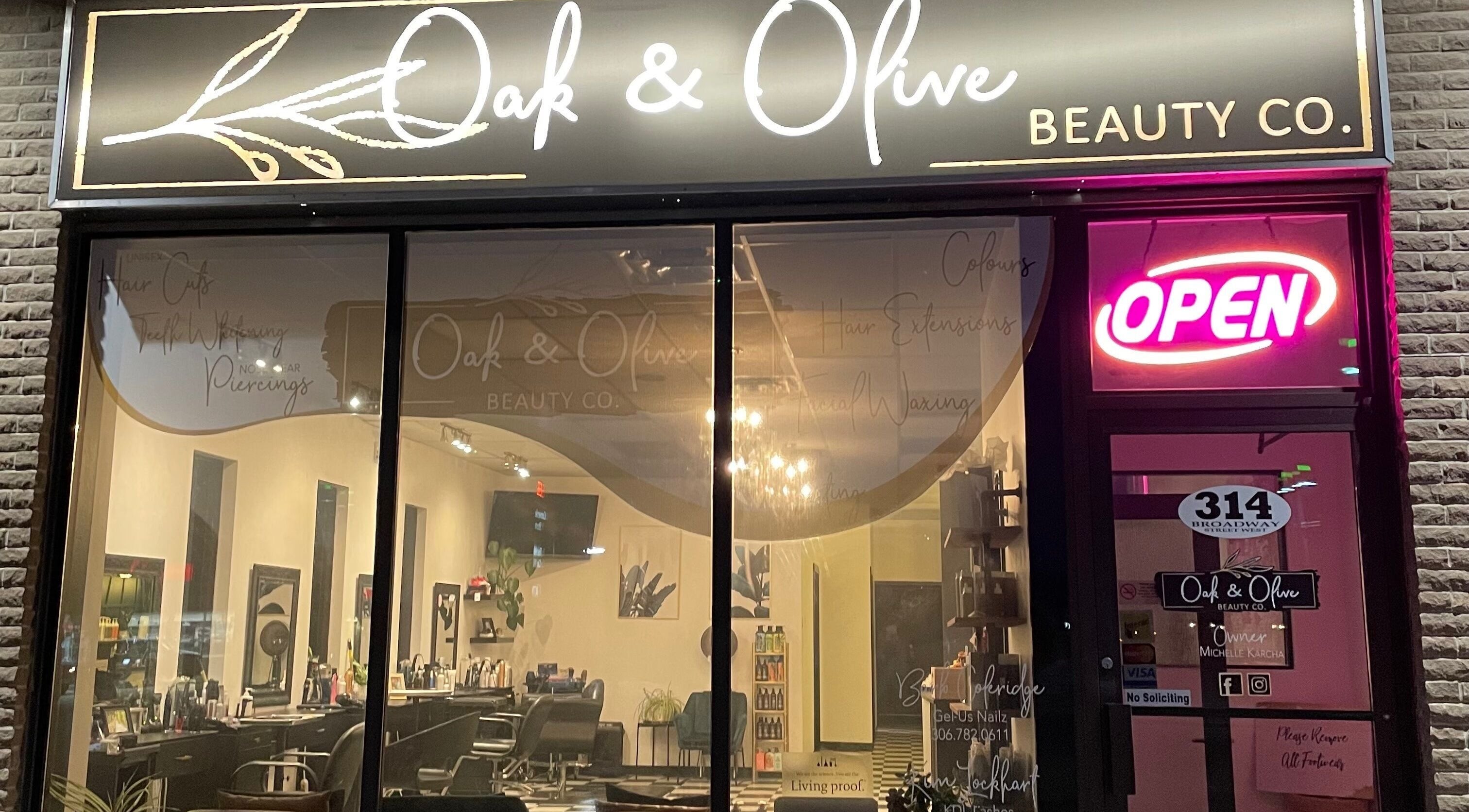 Front view of Oak and Olive Beauty Co in Yorkton, Saskatchewan, CA with illuminated signage and open sign.