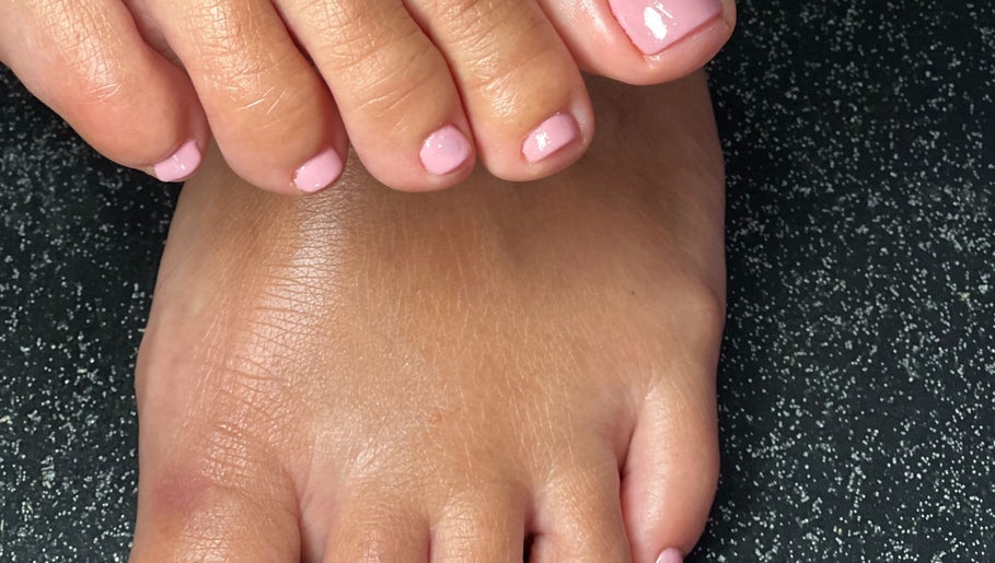 A fresh pink pedicure at BeautyNailBar in Beograd, RS, showcasing neat and well-groomed toenails.