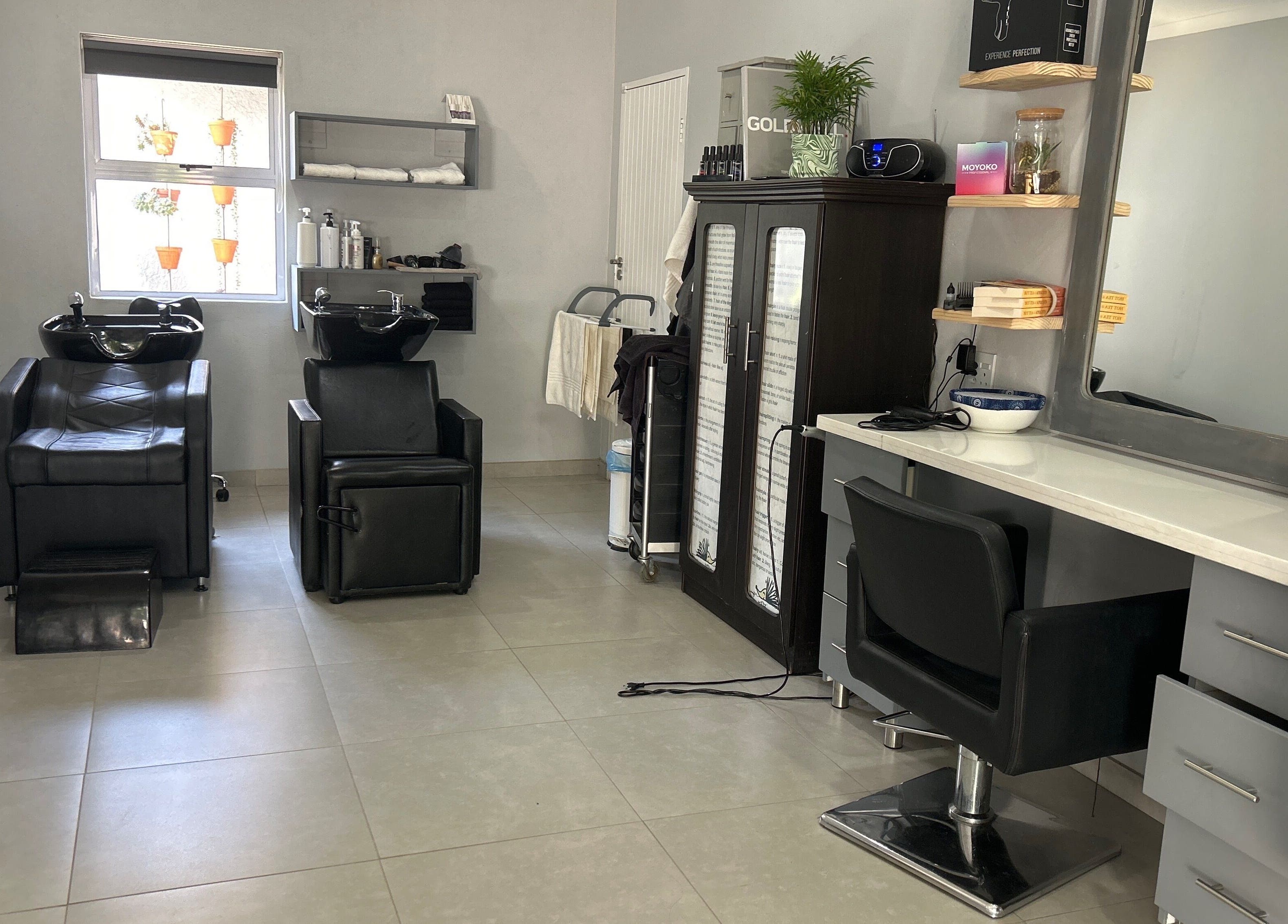 Modern salon interior at Headjogs Hairdressing in Sandton, Gauteng, ZA with stylish chairs and mirrors.