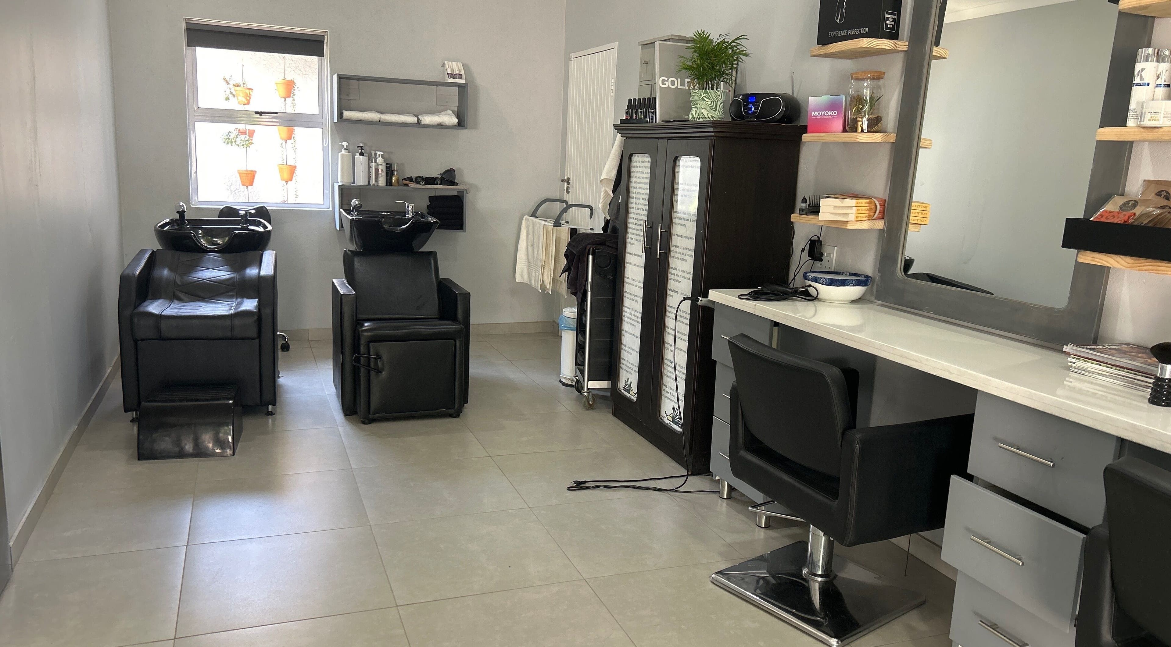 Modern salon interior at Headjogs Hairdressing in Sandton, Gauteng, ZA with stylish chairs and mirrors.