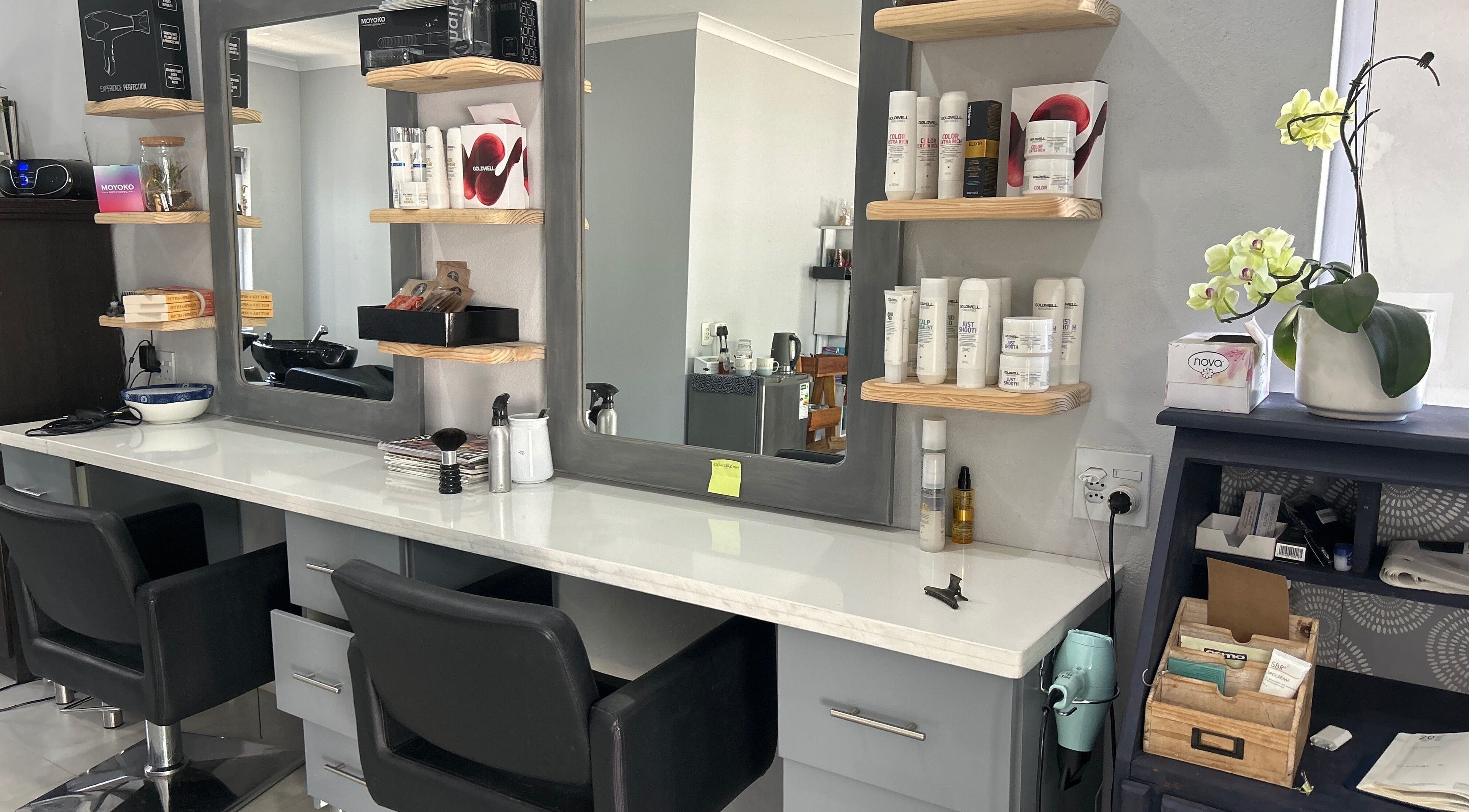 Hairdressing station at Headjogs Hairdressing, Sandton, Gauteng, ZA, showcasing modern equipment and decor.