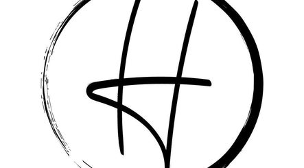 Stylized logo design of Hair United, Launceston, Tasmania, AU, encircled with a modern artistic touch.