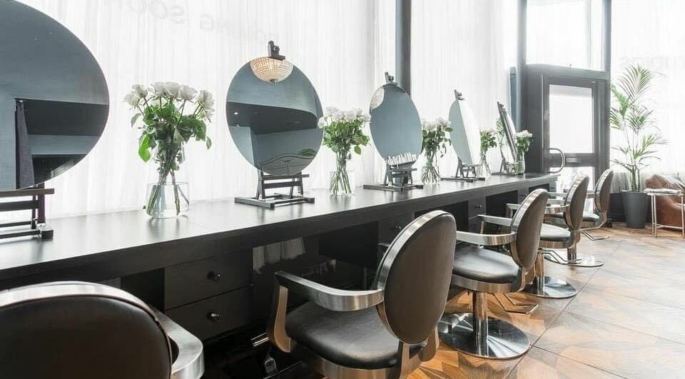 Modern salon chairs and mirrors at WSSTUDIOS Hair Professionals, London, England, GB.