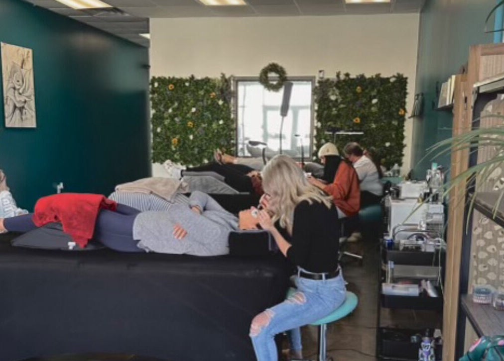 Relaxing beauty treatment in progress at The Beauty Box, Tooele, Utah, US with cozy decor and lush greenery.