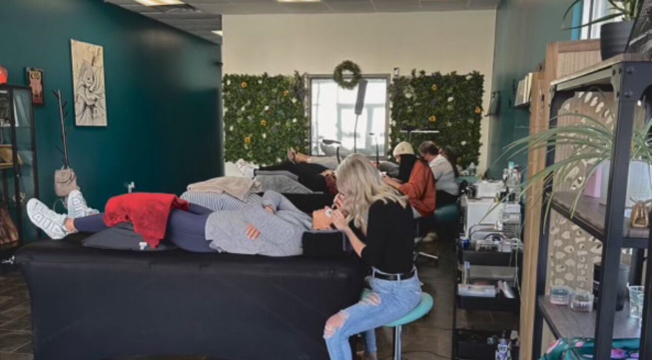 Relaxing beauty treatment in progress at The Beauty Box, Tooele, Utah, US with cozy decor and lush greenery.