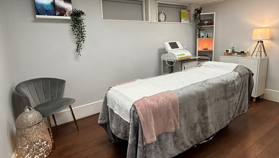 Cozy treatment room at Salon No.6 Hair And Beauty, Norwich, England, GB, featuring a plush massage bed.