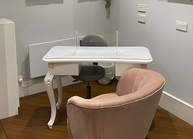 Elegant manicure station at Salon No.6 Hair And Beauty in Norwich, England, GB, featuring plush seating.