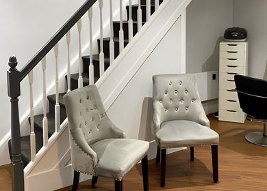 Chic seating area at Salon No.6 Hair And Beauty, Norwich, England, GB, featuring stylish chairs and modern decor.