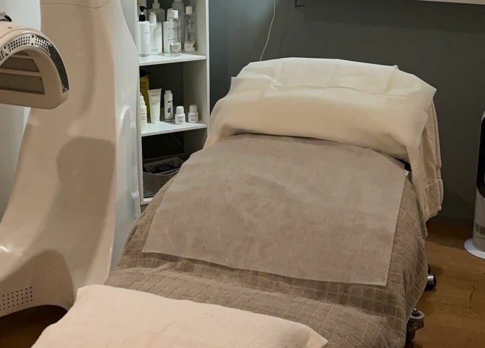 Cozy treatment bed at Dynamic Skin Services in Crawley, Western Australia, AU for ultimate relaxation.