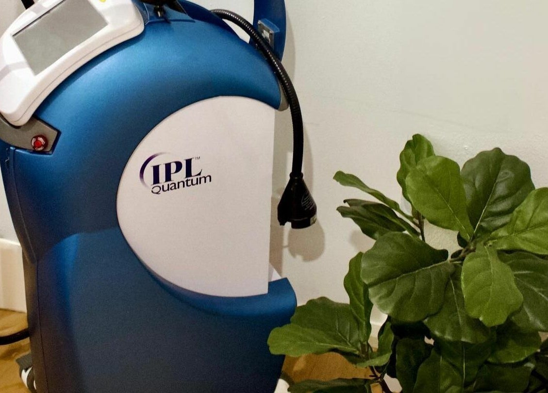 IPL machine at Dynamic Skin Services, Crawley, Western Australia, AU enhances skin treatments amid lush plants.