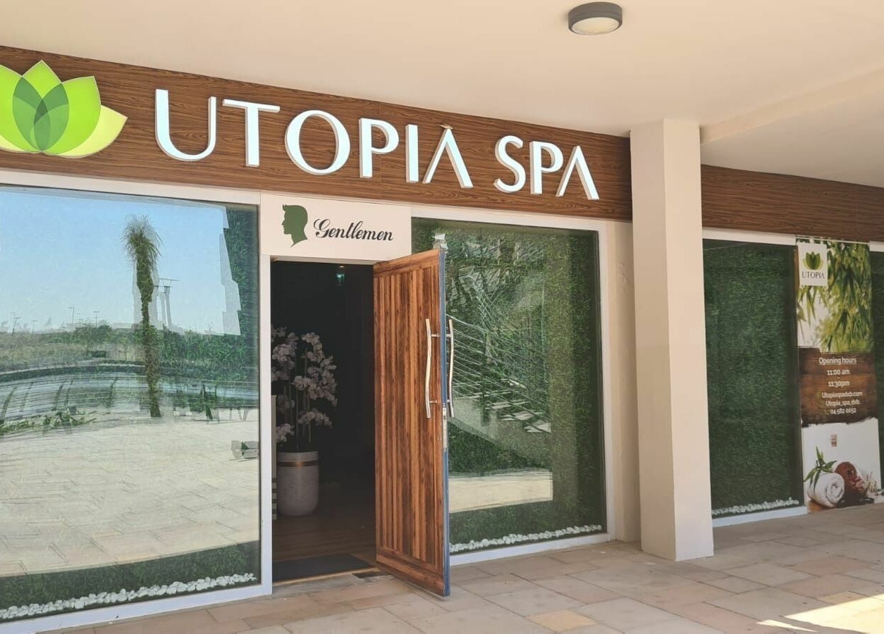 Utopia Spa entrance in Dubai, Dubai, AE with greenery and inviting open door.