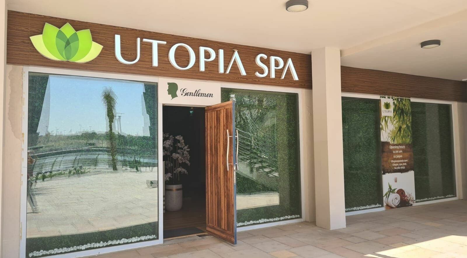 Utopia Spa entrance in Dubai, Dubai, AE with greenery and inviting open door.