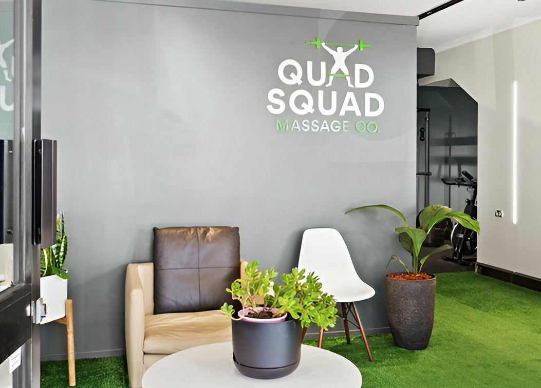 Inviting lobby at Quad Squad Massage Co, Rosebery, New South Wales, AU with cozy seating and lush plants.
