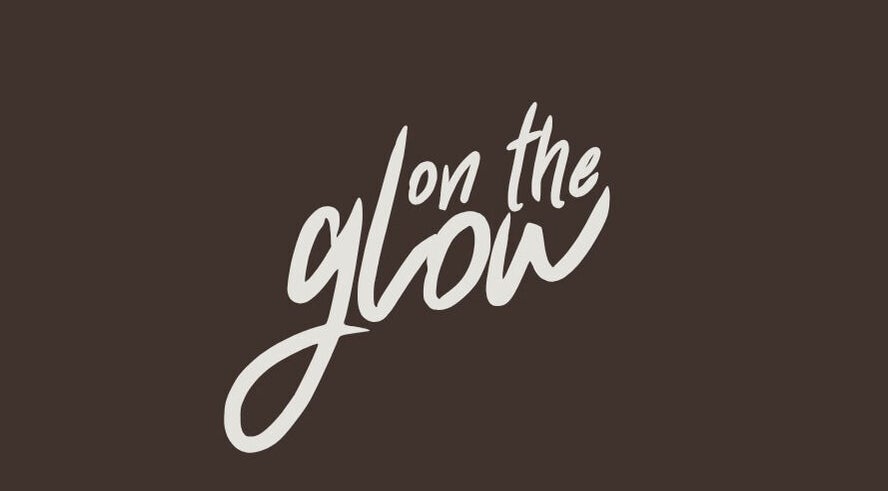 Logo of On the Glow Spray Tans in Alliance, Ohio, US on a dark background.