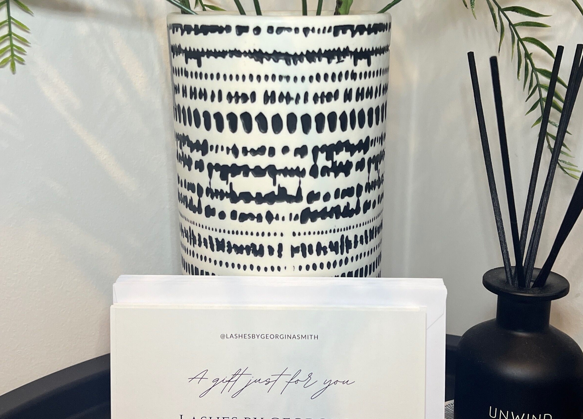 Elegant vase and aroma diffuser at Lashes by Georgina, Andover, England, GB, enhancing a tranquil ambiance.