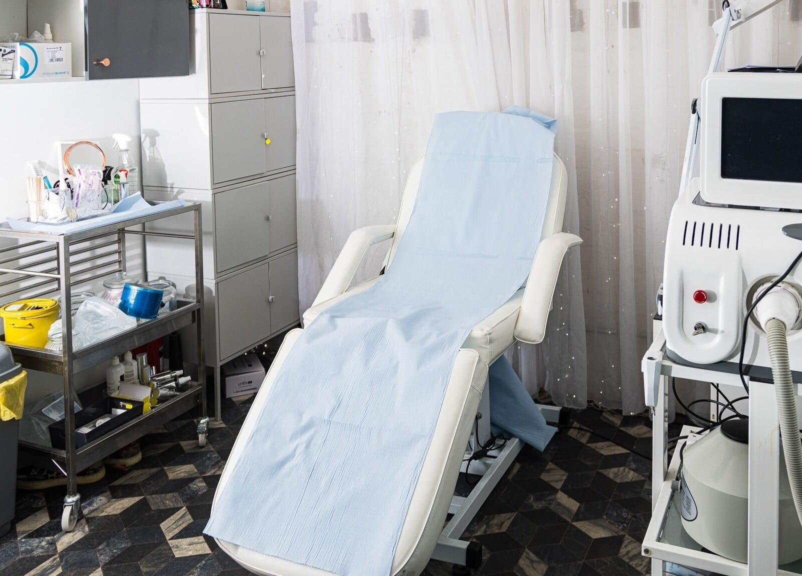 Beauty treatment room at Metamorph Haus, Liverpool, England, GB, featuring a modern spa bed and equipment.