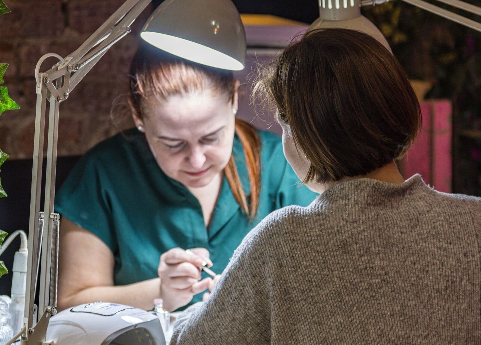 Nail technician at Metamorph Haus creates elegant manicure in Liverpool, England, GB.