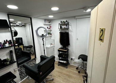 Modern salon at Renan Cogo, London, England, GB, featuring stylish decor and premium hair products.