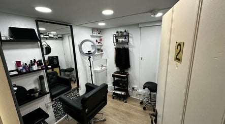 Modern salon at Renan Cogo, London, England, GB, featuring stylish decor and premium hair products.