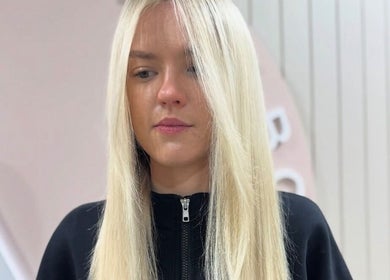 Blonde hairstyle at Victoria Melbourne Stylist, Melbourne, Victoria, AU. Modern salon interior visible.