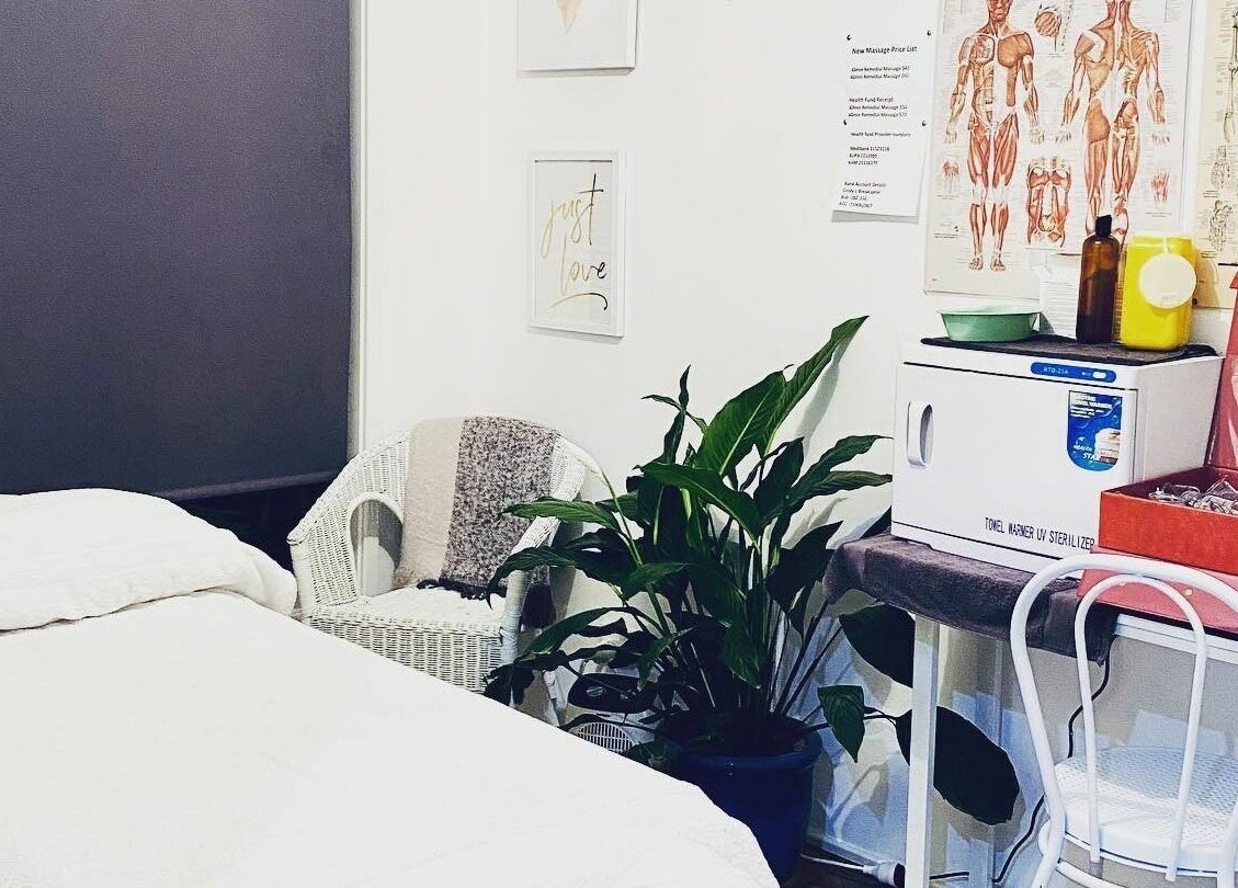 Relaxing massage room at Cindy’s Remedial Massage in Shellharbour, New South Wales, AU with bed and plants.