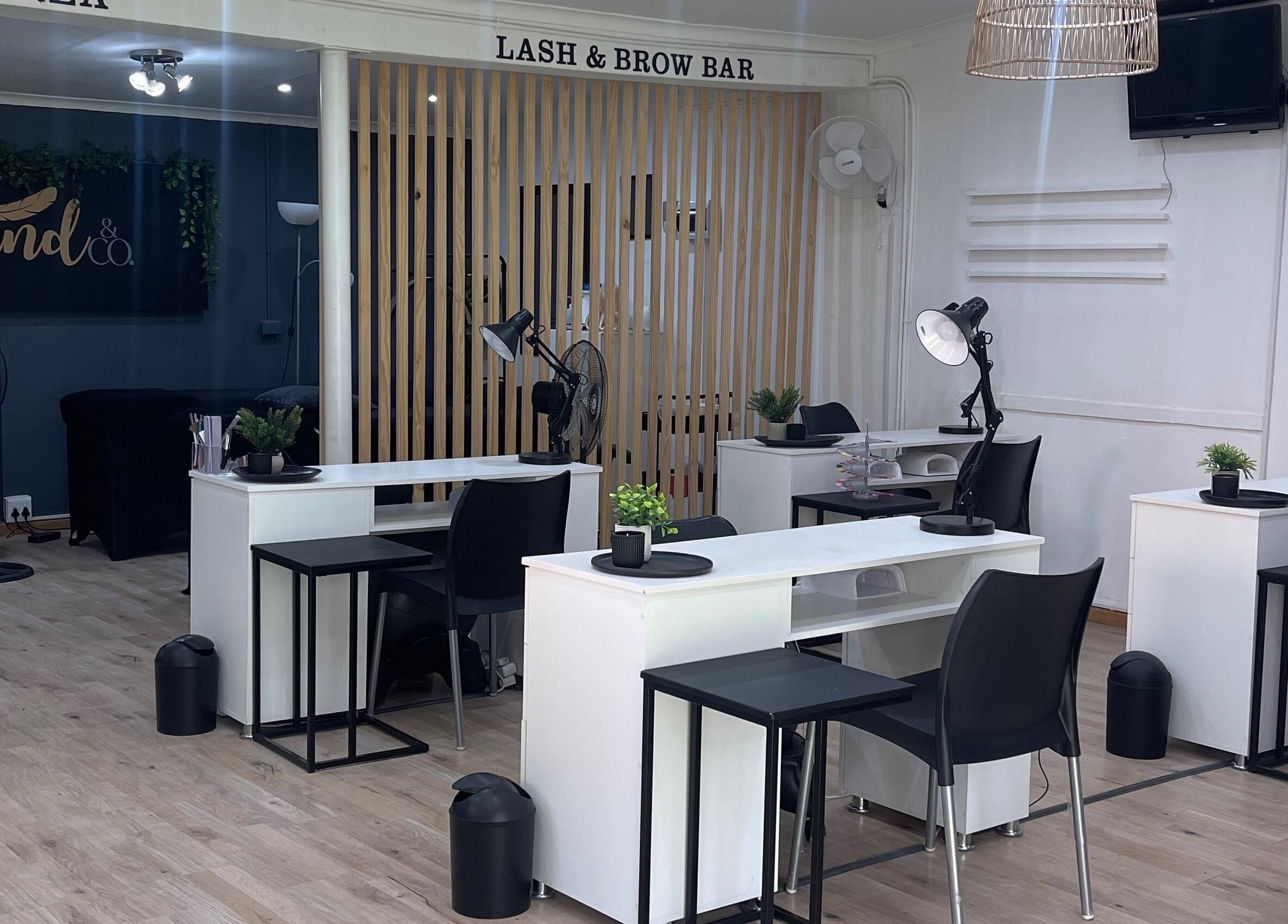 Modern lash and brow bar at LILYMAE Beauty Esthetics & Co, Alberton, Gauteng, ZA with sleek white desks.
