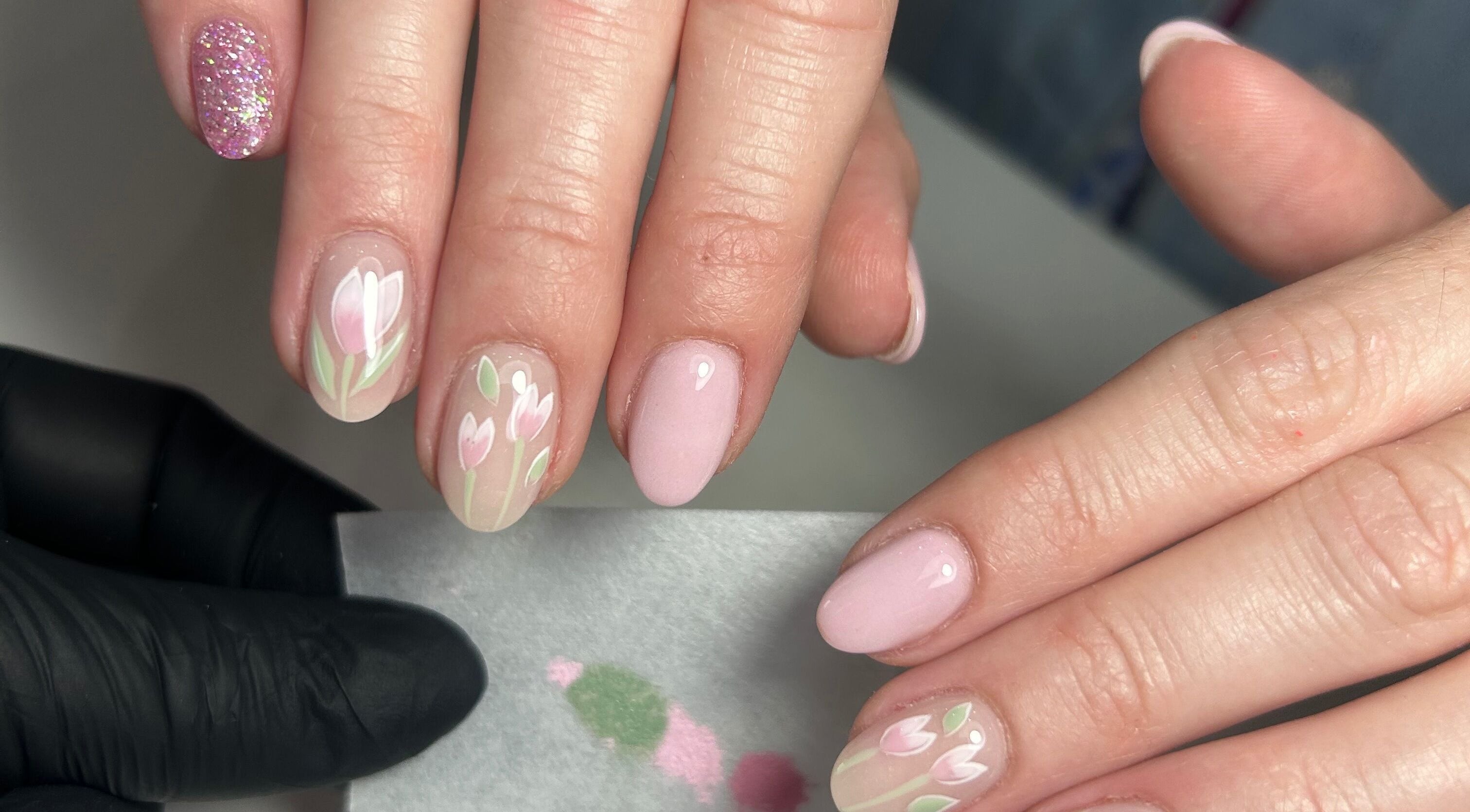 Elegant floral nail art at LILYMAE Beauty Esthetics & Co, Alberton, Gauteng, ZA, showcasing delicate pink designs.