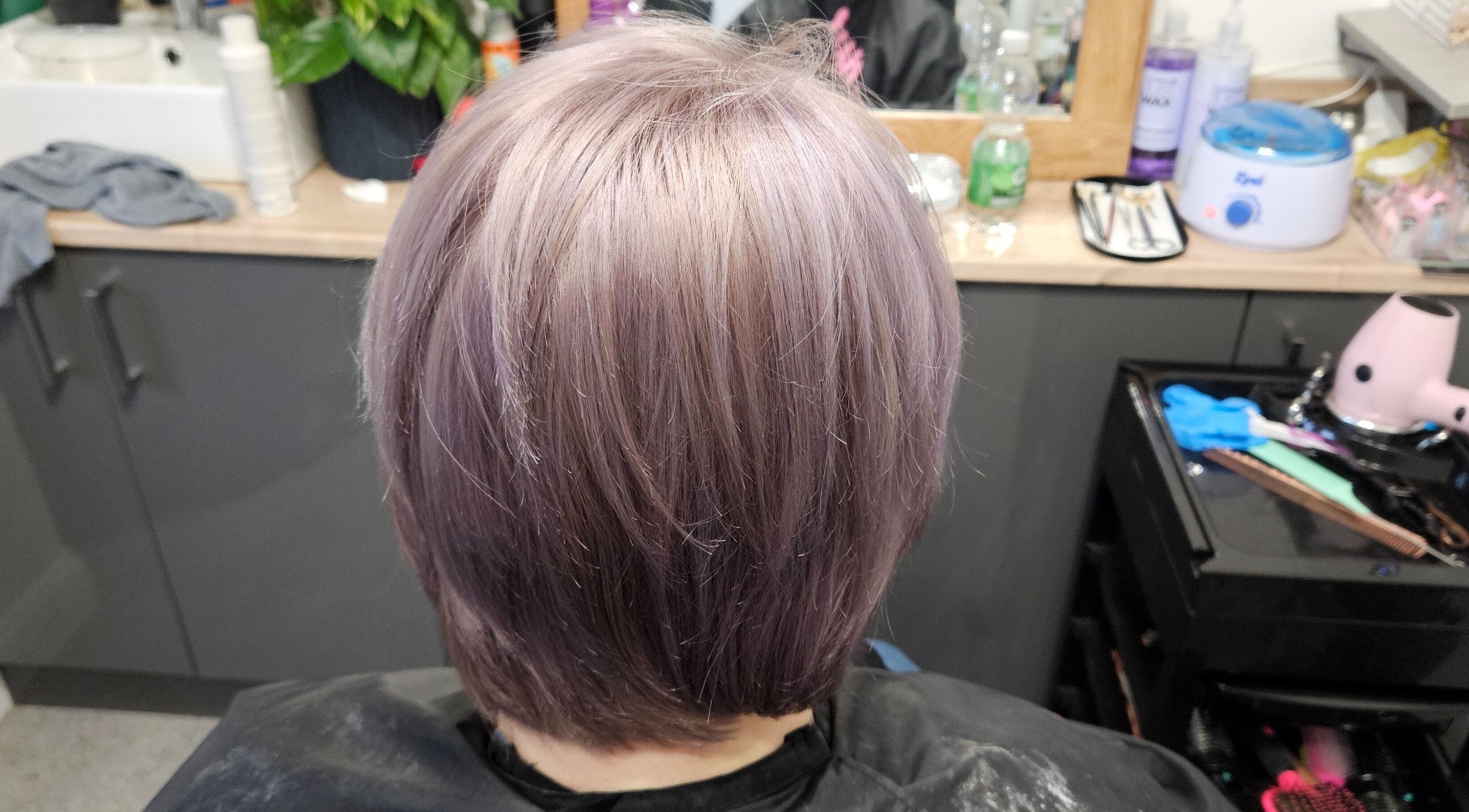 Lavender hair color at Inclusion Hair and Beauty, Scarborough, England, GB on a sleek bob cut.